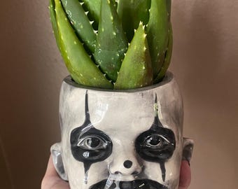 Scary clown child ceramic planter