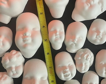 Lote de caras de muñecas espeluznantes al azar sin esmaltar