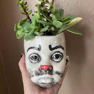 Sad Clown baby head flower pot