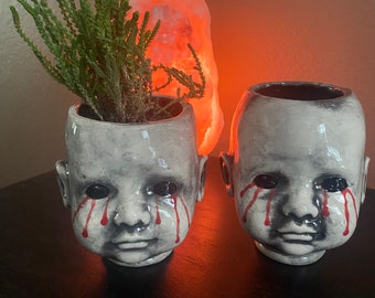 Larger tears baby head planter