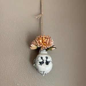 Hanging kewpie head vase