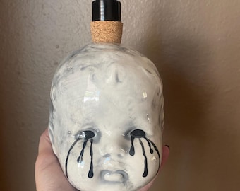 Doll head soap dispenser