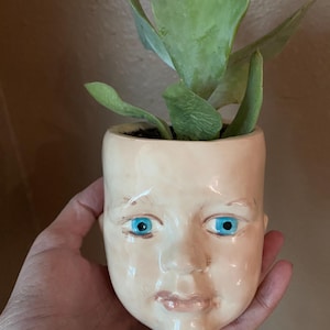 Doll  head planter handmade.