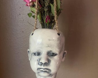 Hanging  baby head flower vase