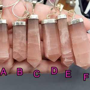 May include: Six pink crystal pendants with silver settings, labeled A through F.