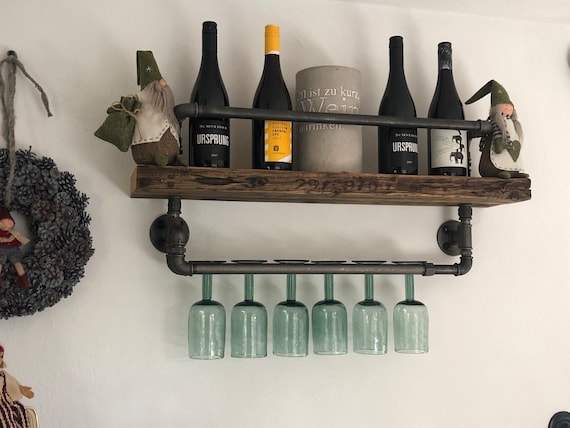 I made this wall rack out of pallet wood and cast iron pipe. Now I