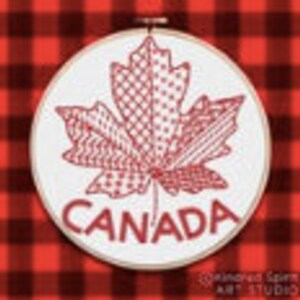 May include: A red embroidered maple leaf with the word "CANADA" underneath, on a white circular background.