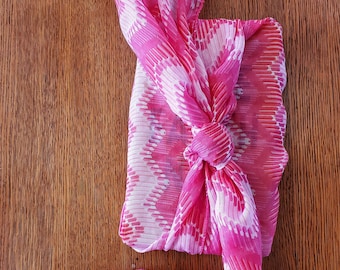 Earth-friendly SCARF LOVERS GIFT: Love Earth Now book wrapped in long, sheer pink & white scarf, furoshiki-style