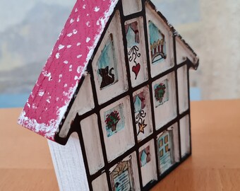 Wooden house painted wooden house half-timbered house winter Christmas cat decoration snow wood snowman flowers wooden door