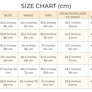 May include: Size chart for clothing in US and EU sizes. The chart shows measurements in inches and centimeters for bust, waist, hips, from shoulder to waist, and skirt length.