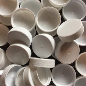 50 large white bottle tops