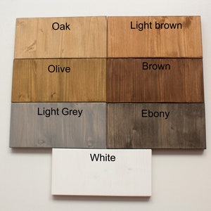 May include: Wood stain color samples in shades of oak, light brown, olive, brown, light grey, ebony, and white.