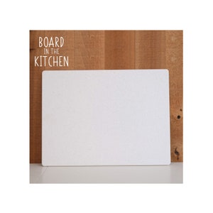 May include: White rectangular cutting board with the text "BOARD in the KITCHEN" on a wood background.
