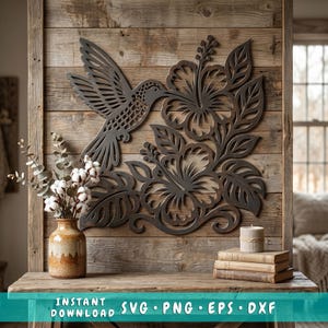 May include: Dark grey metal wall art depicting a hummingbird and hibiscus flowers. The hummingbird is shown in flight, near the flowers. The artwork is mounted on a wooden background. The bottom of the image has the text "INSTANT DOWNLOAD SVG • PNG • EPS • DXXF".