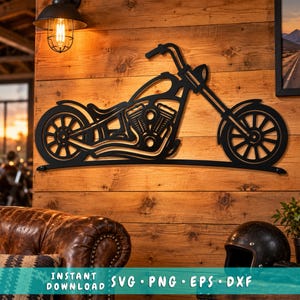 May include: A black metal wall art piece shaped like a chopper motorcycle with a long front fork, spoked wheels, and a detailed engine block. The silhouette features a curved frame design and is mounted horizontally on a wooden wall surface.