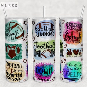 May include: Three stainless steel tumblers with colorful watercolor designs and football-themed text. The tumblers feature phrases like "Football Junkie", "Football Mom", and "My heart is on that field".