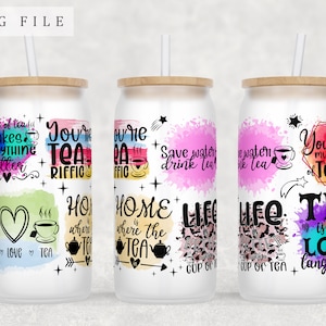 May include: Three white tumblers with colorful watercolor designs and inspirational tea quotes. The quotes include "You're Tea-riffic", "Home is where the tea is", "Life is better with a cup of tea", and "Tea is my love language".
