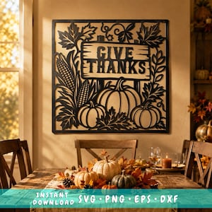 Puede incluir: Una pieza de arte mural cuadrada de metal negro con un diseño recortado de calabazas, tallos de maíz y hojas de arce que rodean un letrero rectangular central con el texto GIVE THANKS. El diseño está enmarcado por un borde negro.
