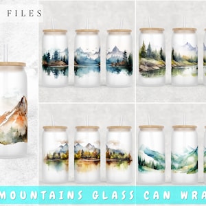 May include: Five watercolour designs of mountains, trees, and a lake, printed on white glass can wraps. The designs are in shades of green, blue, brown, and orange. The can wraps are for 20 oz. tumblers.