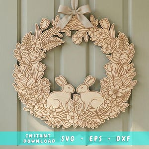 May include: A wooden Easter wreath featuring two rabbits, flowers, tulips, and Easter eggs. The wreath is made of light-colored wood and is suspended by a beige ribbon. The words "INSTANT DOWNLOAD SVG EPS DXF" are at the bottom.