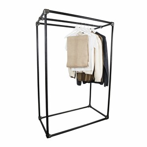 May include: A black metal clothing rack with three horizontal bars and a rectangular base. The rack is holding a beige scarf, a white shirt, and a grey sweater.
