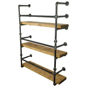 May include: A black metal pipe shelf unit with three wooden shelves. The shelves are made of reclaimed wood and have a rustic look. The unit is mounted to a wall and is perfect for displaying items or storing books.