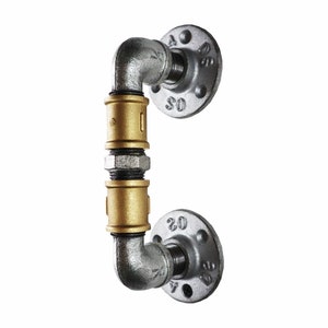 May include: A silver and gold industrial pipe door handle with two flanges. The flanges are marked with the numbers "20" and "45".