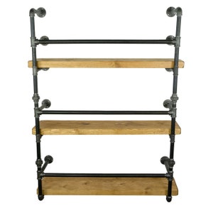 May include: Three-tiered industrial-style shelf unit with black metal pipes and wooden shelves.