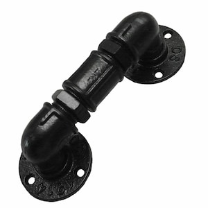 May include: Black industrial style pipe handle with two 90 degree elbows and two round flanges. The flanges have three screw holes and the text "D.S." is visible on one flange.