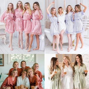 May include: Four groups of women wearing matching satin robes with lace trim. The robes are in various colours, including pink, light blue, rust, and sage green. The women are smiling and posing for a photo.