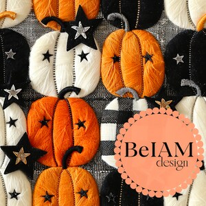 May include: A close-up of a variety of handmade felt pumpkins in orange, white, and black with black and white gingham fabric and a black and white star pattern. The pumpkins are decorated with glitter stars and the text "BelAM design" is visible in the center of the image.