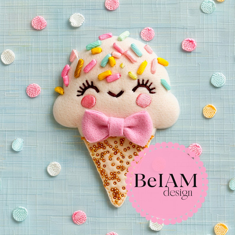 May include: A white felt ice cream cone with a pink bow, decorated with colorful sprinkles and gold beads. The ice cream cone has a smiling face with embroidered eyes and a mouth. The background is a light blue surface with white, pink, and yellow polka dots. The text "BelAM design" is on a pink circle.