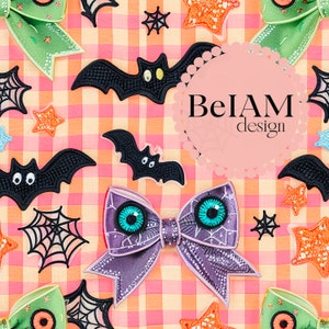 May include: A purple bow with a spiderweb design and large blue eyes. The bow is surrounded by black bats, stars, and spiderwebs on a pink and white gingham background. The text "BelAM design" is in a circle in the upper right corner.