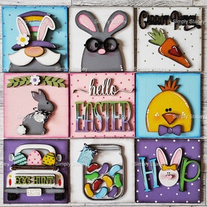 May include: Nine wooden signs with various Easter themes. The signs feature a bunny, a chick, a carrot, jelly beans, an egg hunt truck, and the words "hello easter" and "hop".