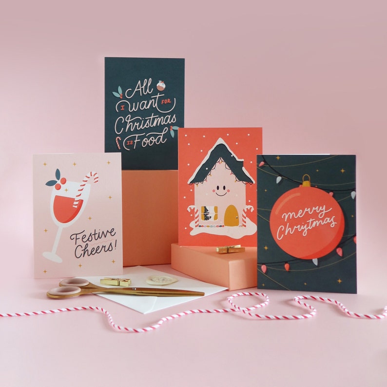 Christmas card pack, 4 designs including: Merry Christmas Bauble, All I Want For Christmas Is Food, Festive Cheers, Christmas House Design. image 1