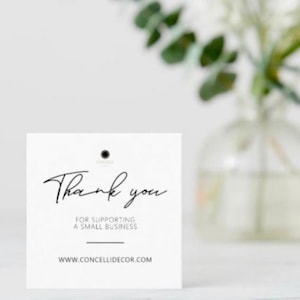 May include: White thank you card with black text that reads "Thank you for supporting a small business" and "www.concellidecor.com".