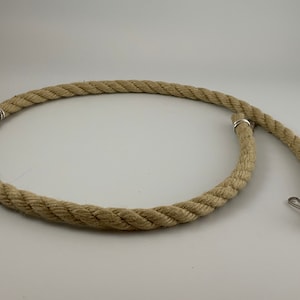 natural rope pet toy suitable to hang in cage. The rope is in a curved shape and is attached to the cage with metal hooks.