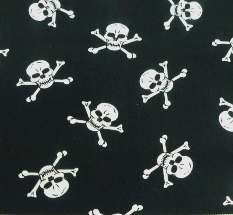 May include: Black fabric with a repeating pattern of white skull and crossbones.
