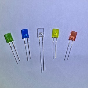 May include: Five LED lights with different colored lenses: green, blue, clear, yellow, and red. The lights are mounted on two wire leads.