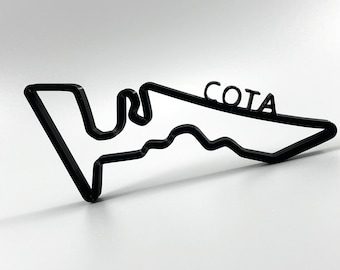 May include: Black outline of the Circuit of the Americas racetrack, also known as COTA, in Austin, Texas. The track is a popular venue for Formula One races.