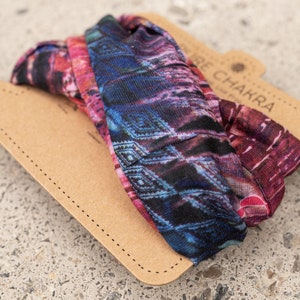 May include: A colorful patterned headband with a brown cardboard tag that says "The Chakra".