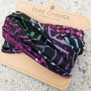 May include: A black and purple patterned headband with a brown card attached. The card says "Pure Chakra" and "Live Hippie. Live Free."