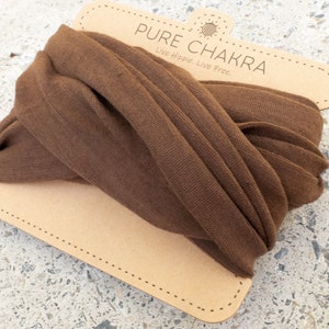 May include: Brown fabric headband with the text "PURE CHAKRA" and "Live Hippie. Live Free." on a cardboard tag.