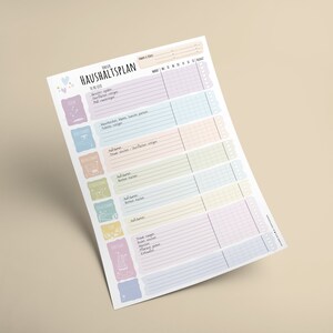 May include: A printable household chore planner with a colorful design. The planner includes a list of chores, such as laundry, dishes, and vacuuming, and a grid for scheduling them throughout the week.