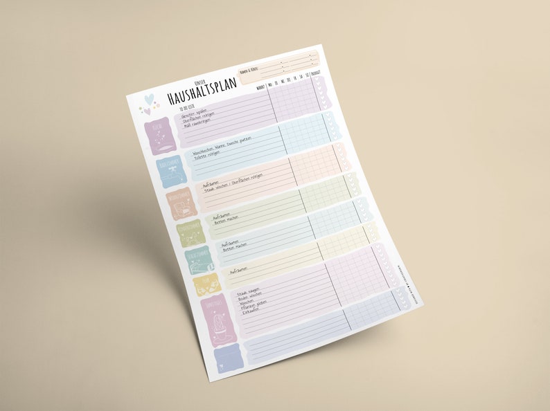 May include: A printable household chore planner with a colorful design. The planner includes a list of chores, such as laundry, dishes, and vacuuming, and a grid for scheduling them throughout the week.