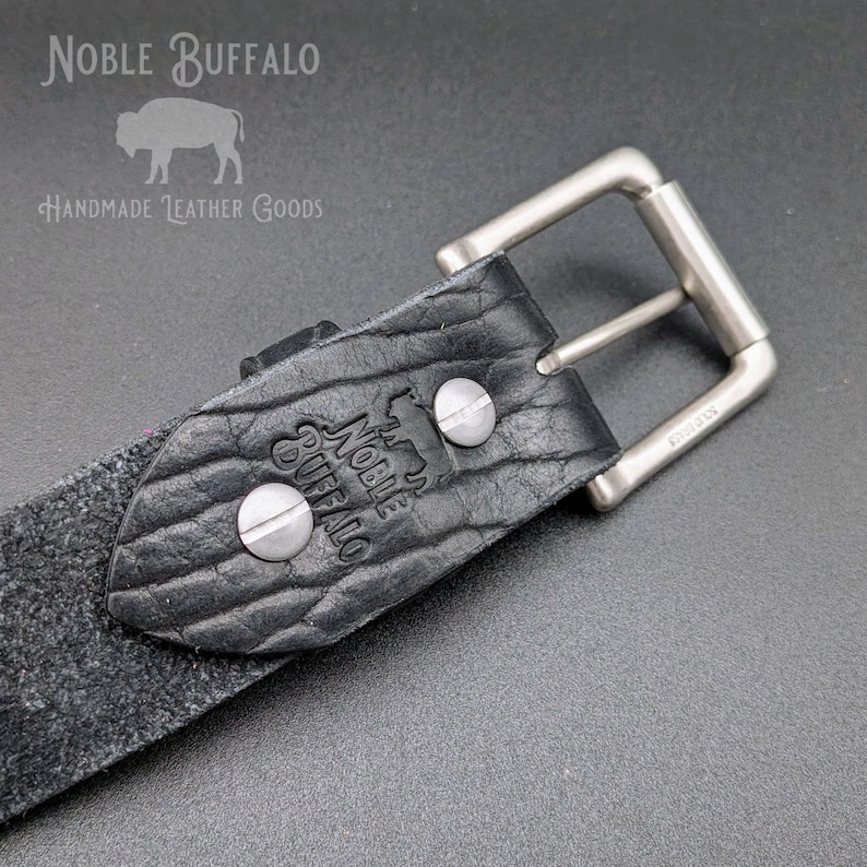 Close-up of black American Bison handmade leather belt with solid metal buckle and hardware, American made full grain leather belt