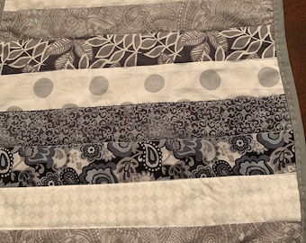 90 inches x 14 inch padded table runner; reversible.