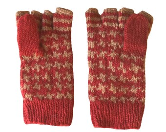 May include: A pair of red and brown fingerless gloves with a geometric pattern. The gloves are knitted and have a thumb hole.