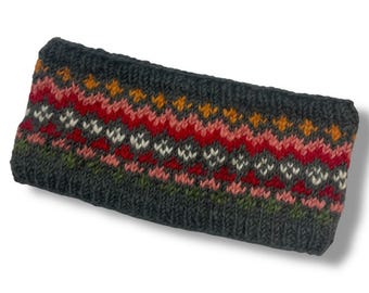 May include: Gray knitted headband with a colorful geometric pattern in shades of red, pink, orange, green, and white.