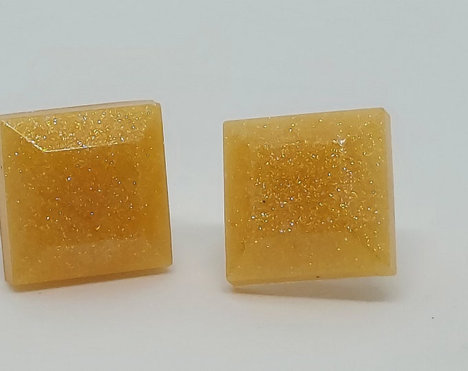Golden shimmer diamond stud earrings on silver posts